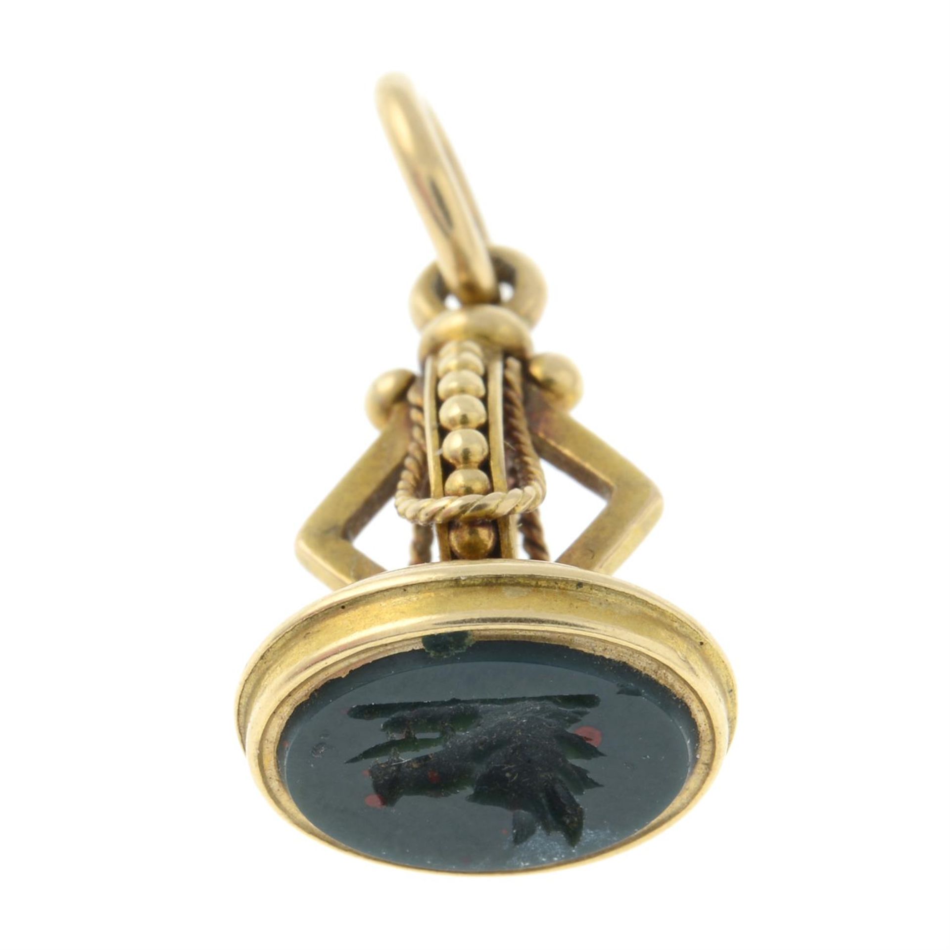 A late Victorian gold decorative fob, with bloodstone seal depicting a boar's head.