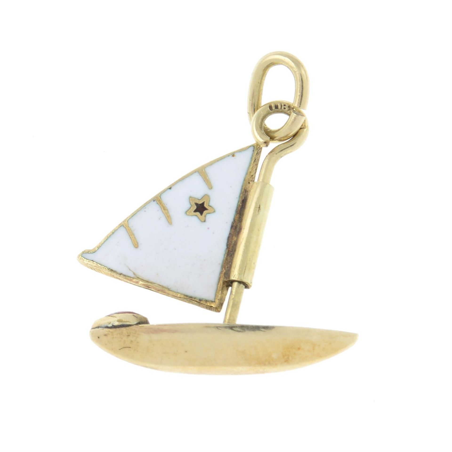 A mid 20th century gold sailing boat charm, with red enamel heart bow and white enamel sail.