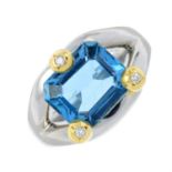 A blue topaz and diamond dress ring.