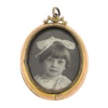 A late Victorian 9ct gold double-sided photograph locket pendant.