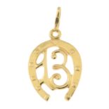 A mid-20th century '13' horseshoe pendant, by Uno-A-Erre.