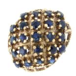 A late 20th century 9ct gold and sapphire bombe dress ring.