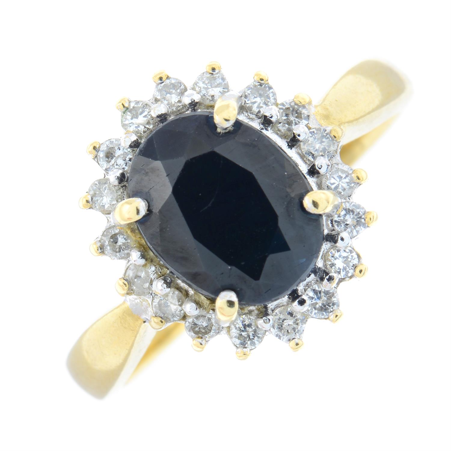 An 18ct gold sapphire and diamond cluster ring.