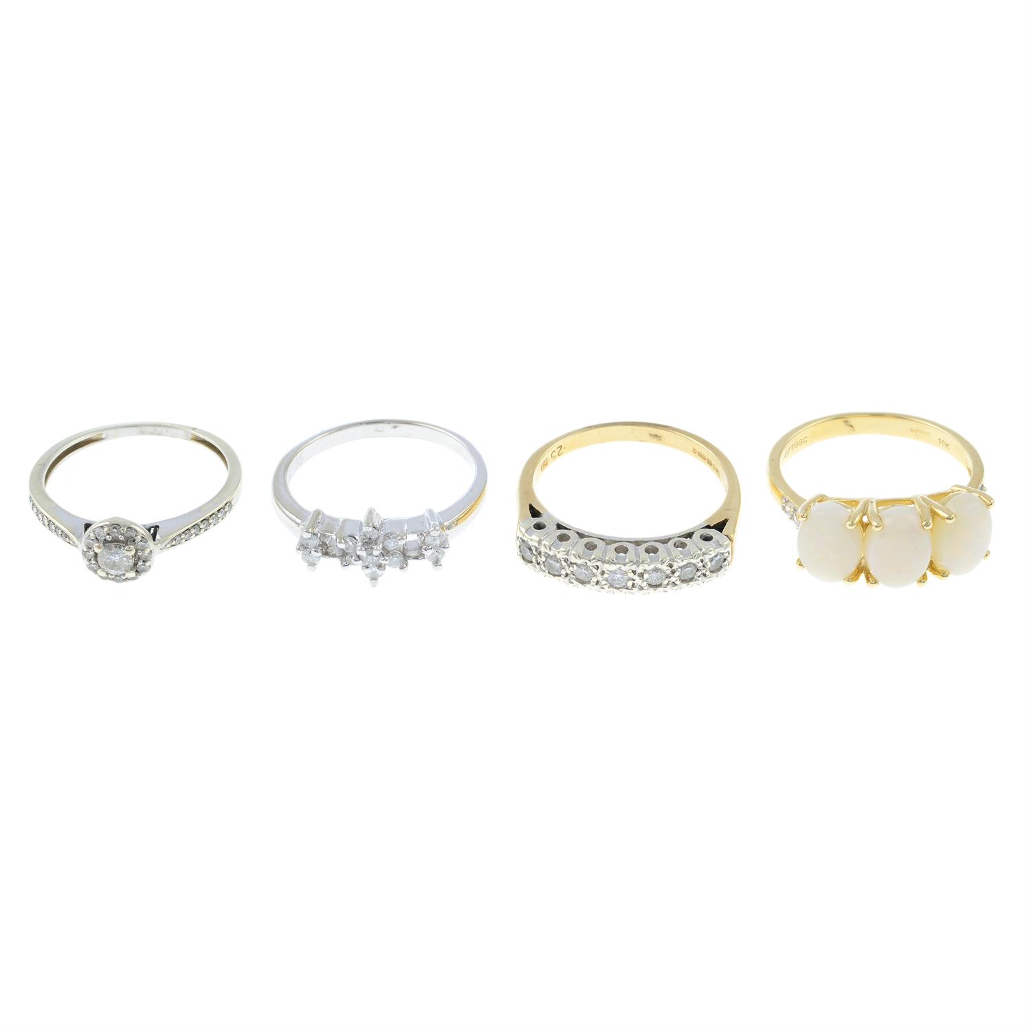 Four gem-set rings, comprising three diamonds ring and one opal ring.