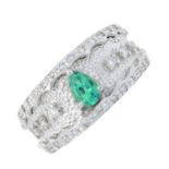 An emerald and diamond dress ring.