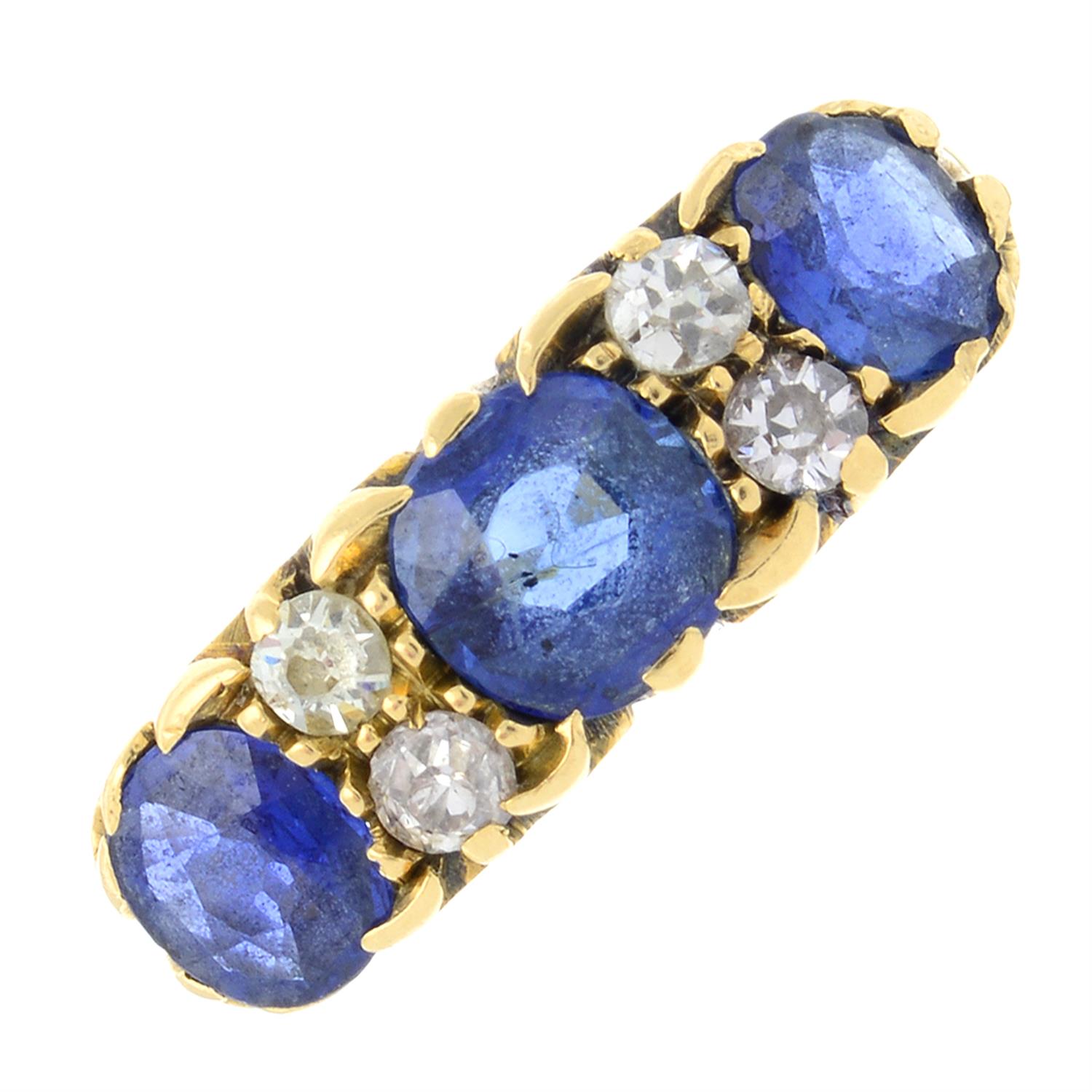 An early 20th century 18ct gold sapphire three-stone ring, with old-cut diamond spacers.