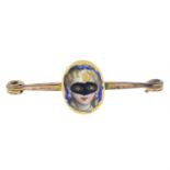A rose-cut diamond and enamel masquerade panel, later applied to a gold plated bar brooch.