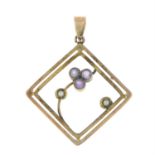 An early 20th century 9ct gold amethyst and split pearl floral openwork pendant.