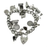 A silver charm bracelet, with heart-shape padlock clasp, suspending seventeen charms.