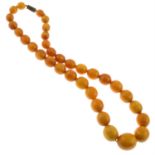 A graduated amber bead necklace.