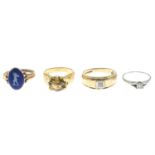 Four gem-set rings.