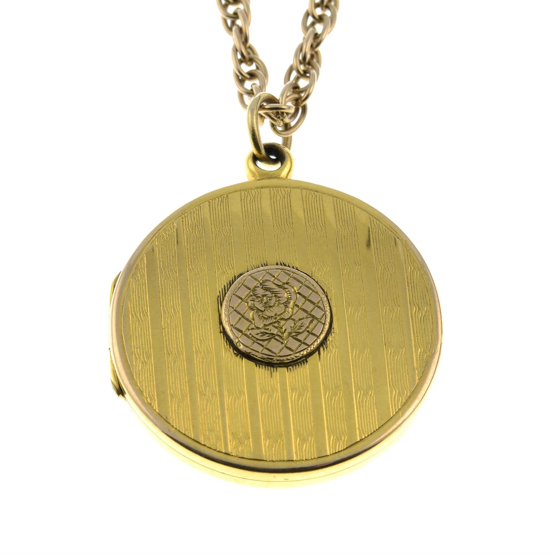An early 20th century 9ct gold floral and striped engraved locket, with 9ct gold chain.