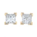 A pair of square-shape diamond stud earrings.