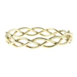 A 9ct gold openwork bangle.