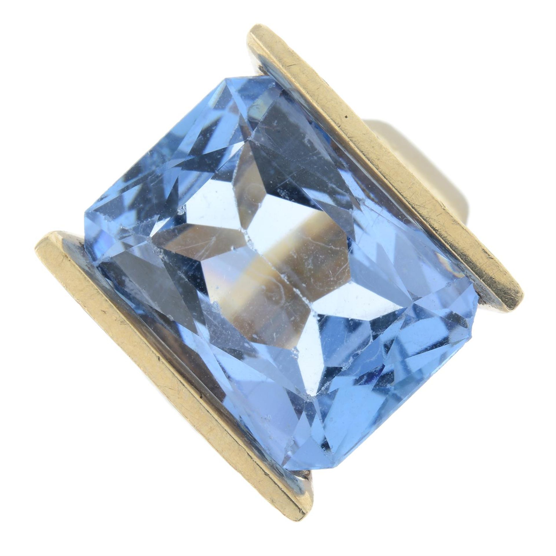 A synthetic blue spinel dress ring.