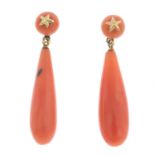 A pair of coral drop earrings.