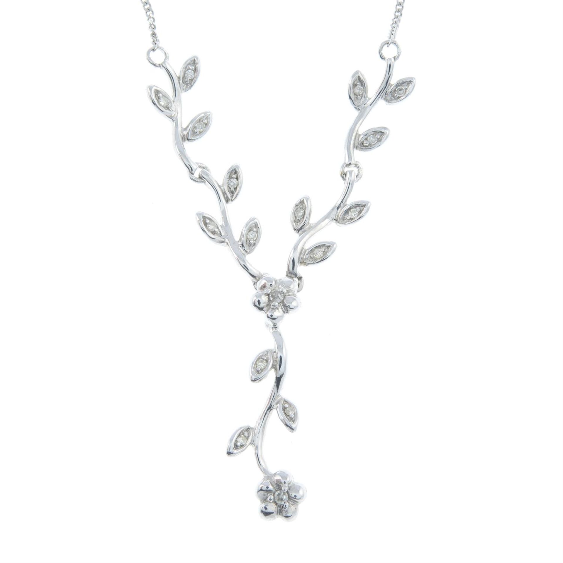 A diamond floral necklace.