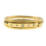 An Edwardian 9ct gold opal and rose-cut diamond hinged bangle.