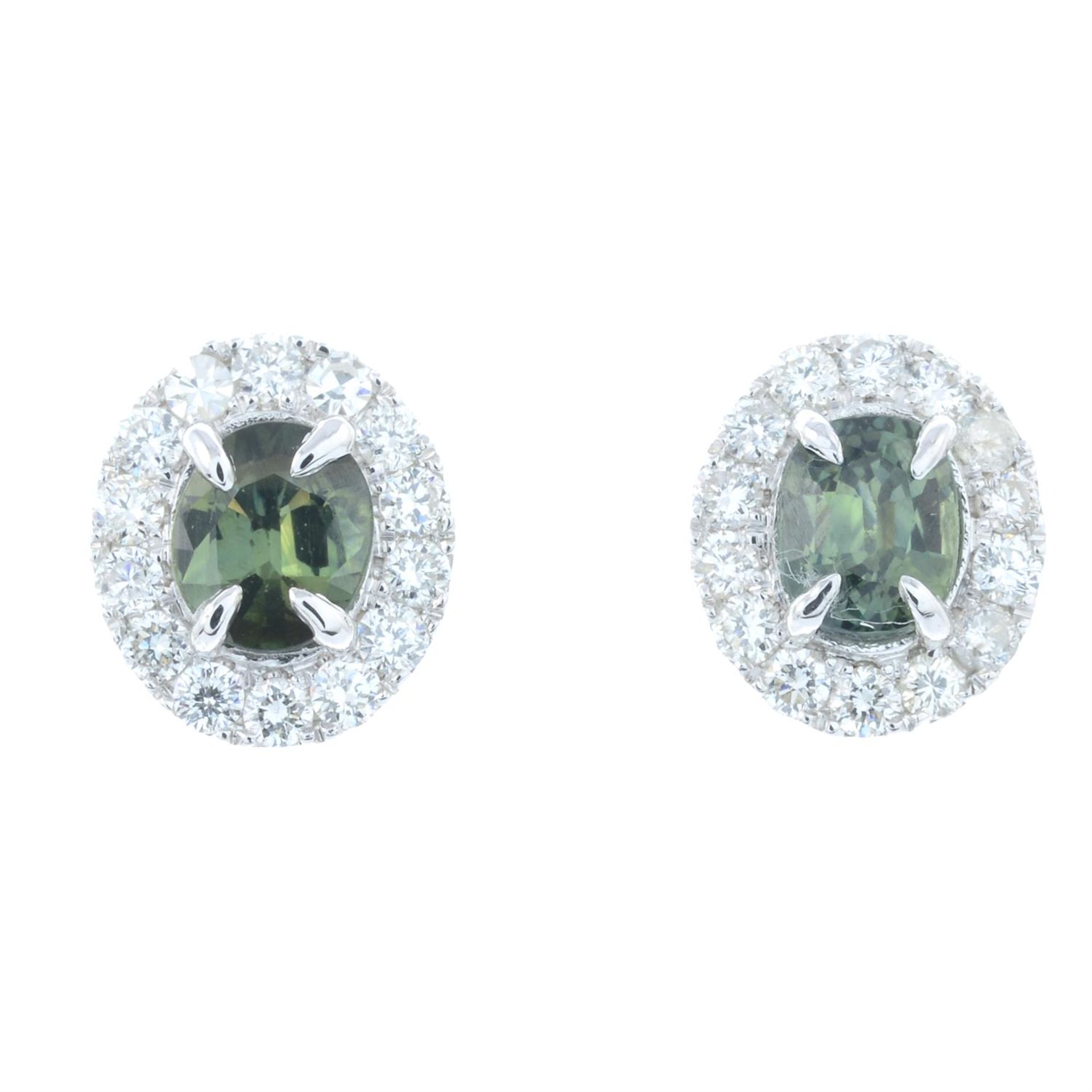 A pair of green tourmaline and diamond cluster earrings.
