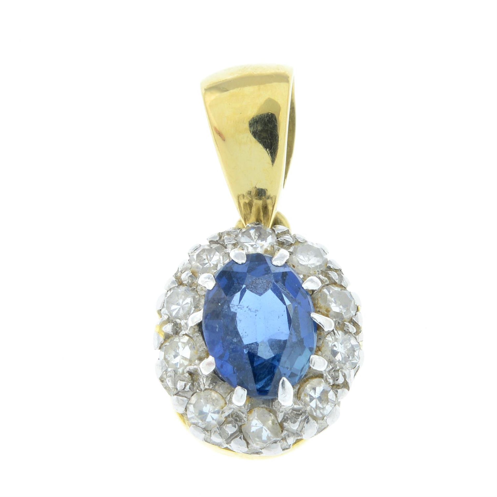 An 18ct gold sapphire and diamond cluster pendant.