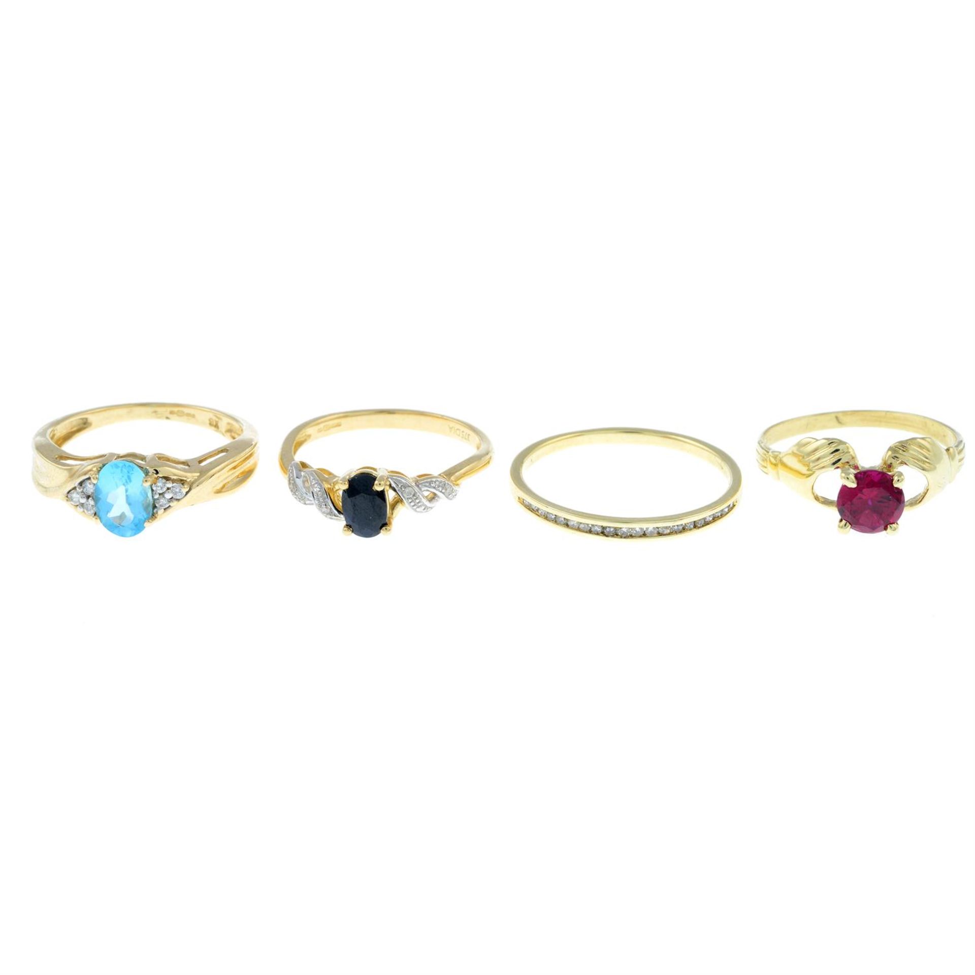 Four gem-set rings.