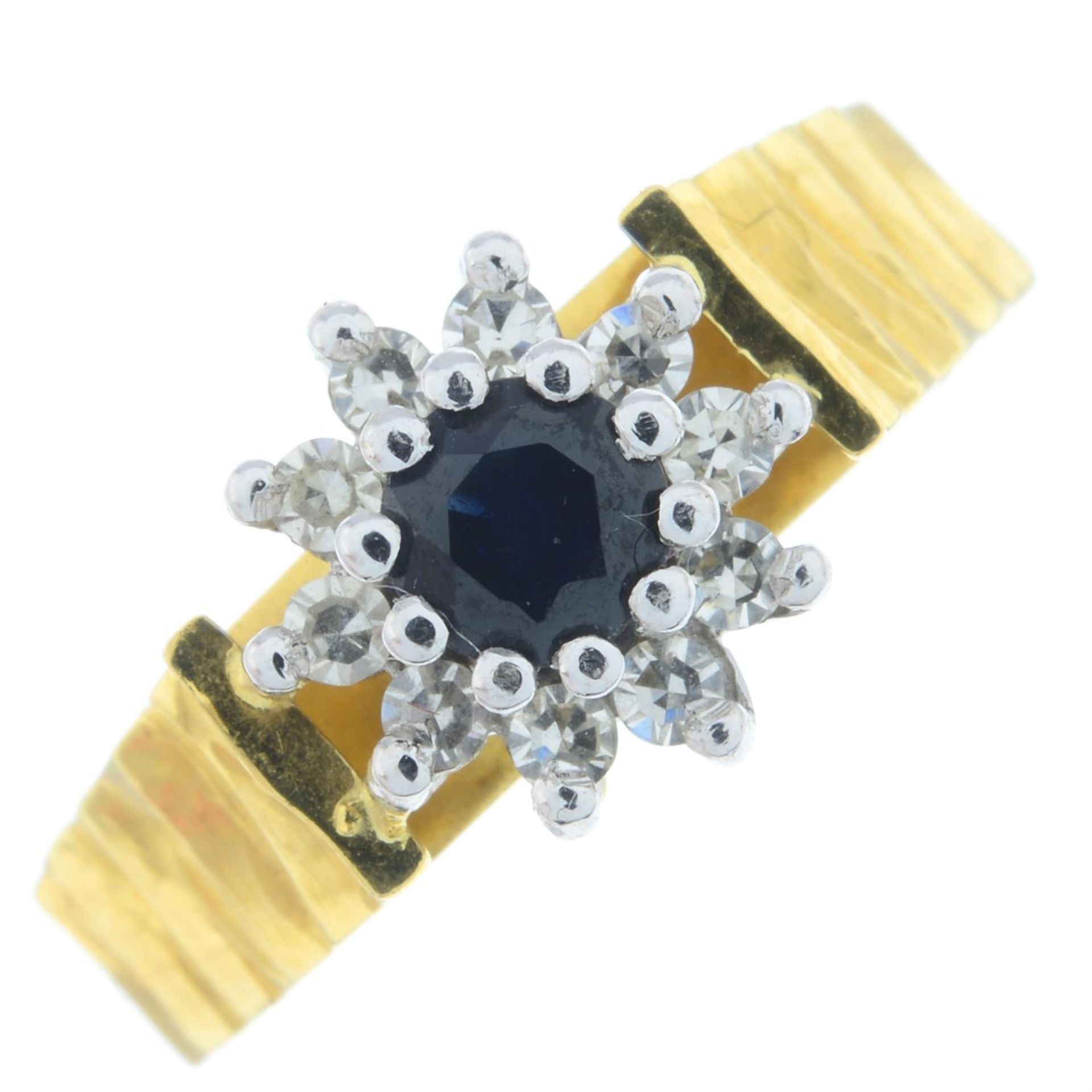 An 18ct gold brilliant-cut diamond and sapphire cluster ring.