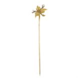 An early 20th century 15ct gold old-cut diamond and seed pearl foliate stickpin.