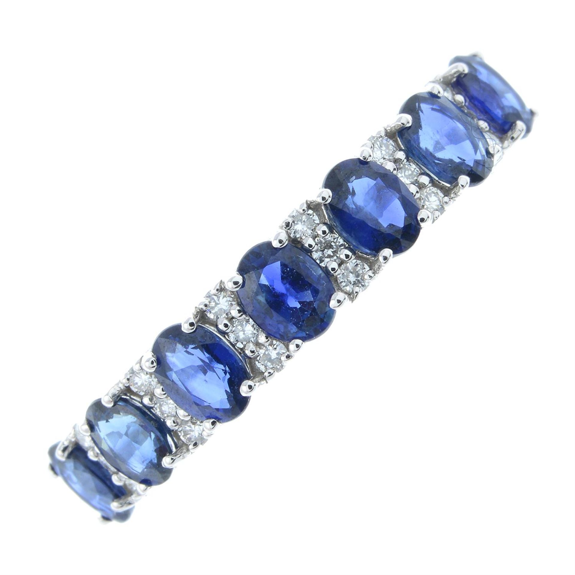 An 18ct gold sapphire and diamond half eternity ring.