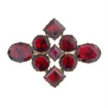 An early 19th century foil-back garnet brooch.