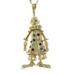 A 9ct gold gem-set clown pendant, with 9ct gold curb-link chain.