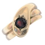 A late Victorian 9ct gold snake ring, with rose-cut diamond eyes and garnet accent.