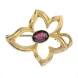 An early 20yth century 9ct gold garnet ivy leaf motif openwork brooch.