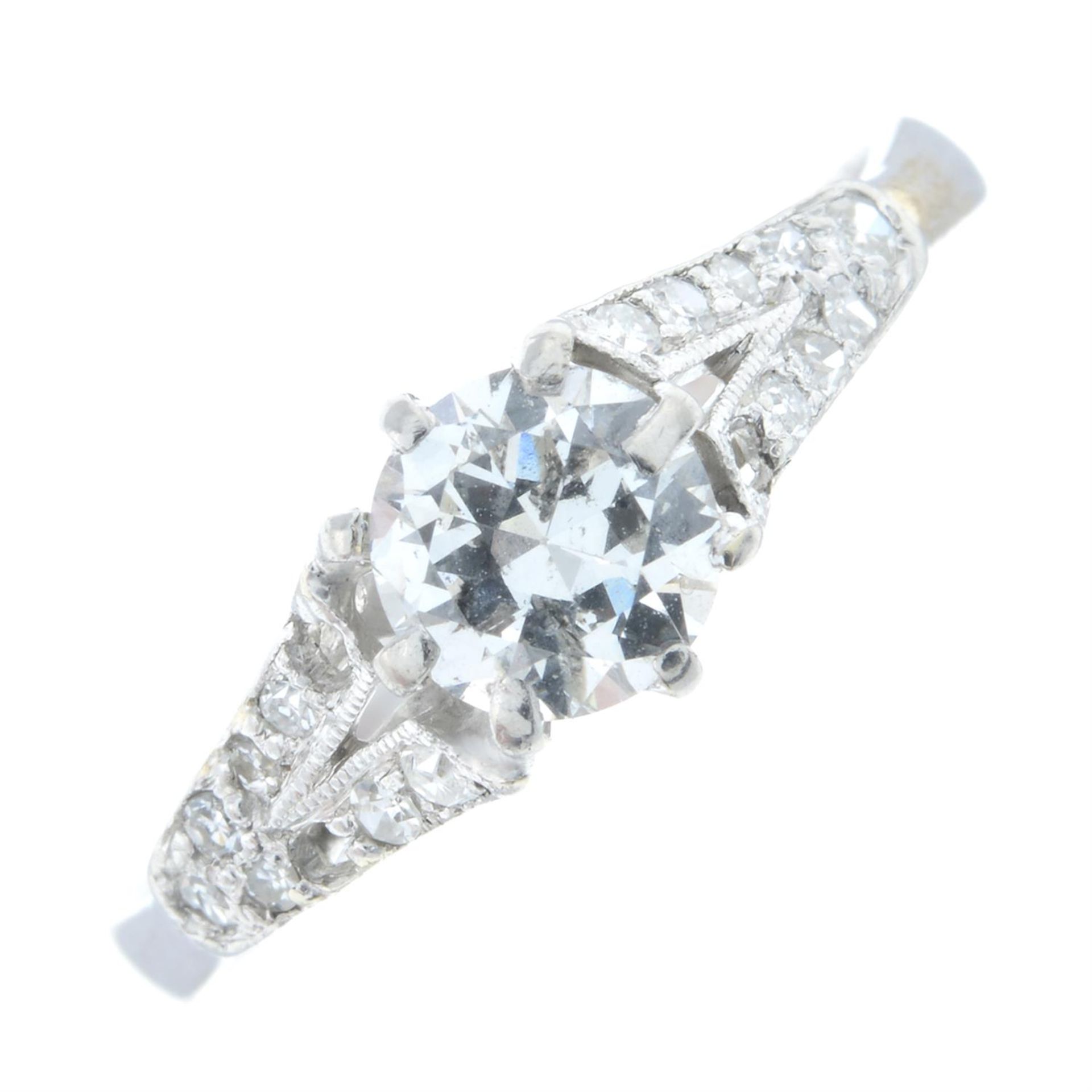 A brilliant-cut diamond single-stoner ring, with pave-set diamond sides.