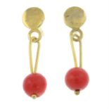 A pair of coral drop earrings.
