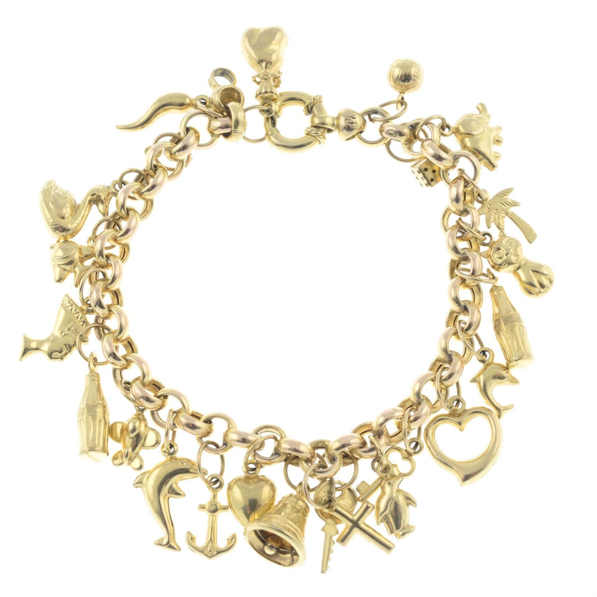 A 9ct gold charm bracelet, suspending twenty-three charms.