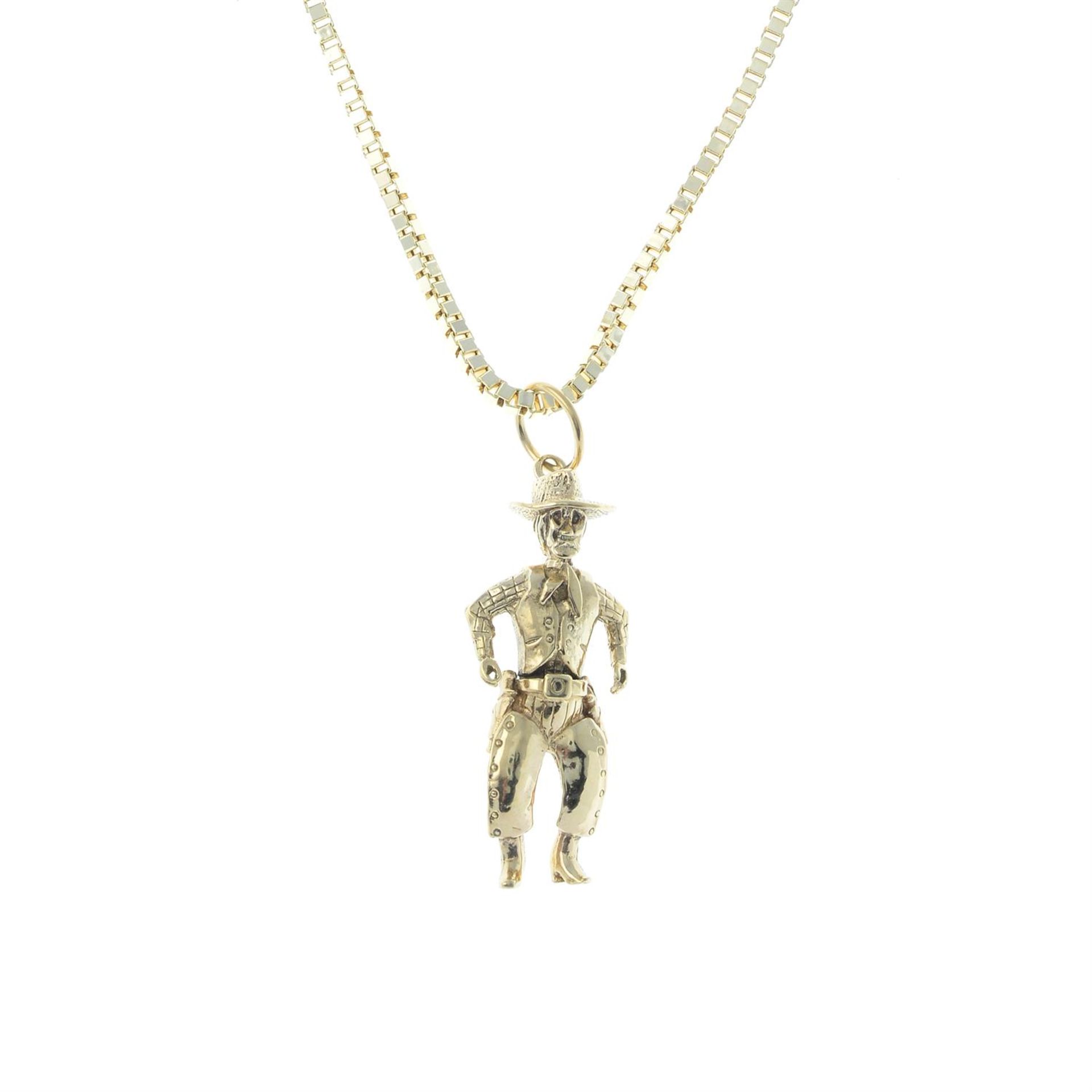 A 9ct gold cowboy pendant, with 9ct gold box-link chain.