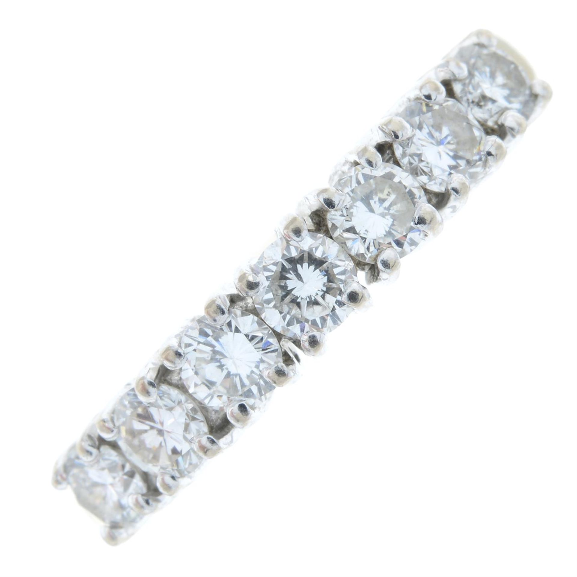 An 18ct gold brilliant-cut diamond half eternity ring.