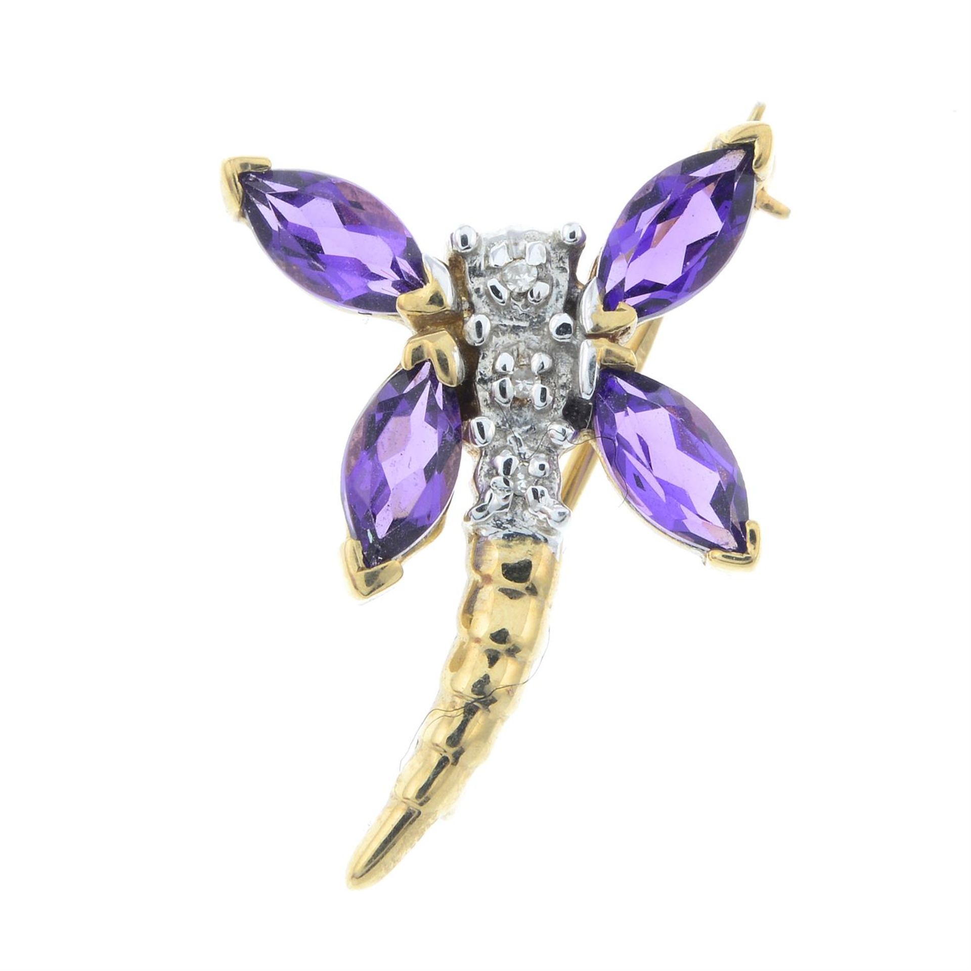 An amethyst and diamond dragonfly brooch.