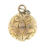 A late Victorian 9ct gold ornate engraved foliate motif orb fob pendant.