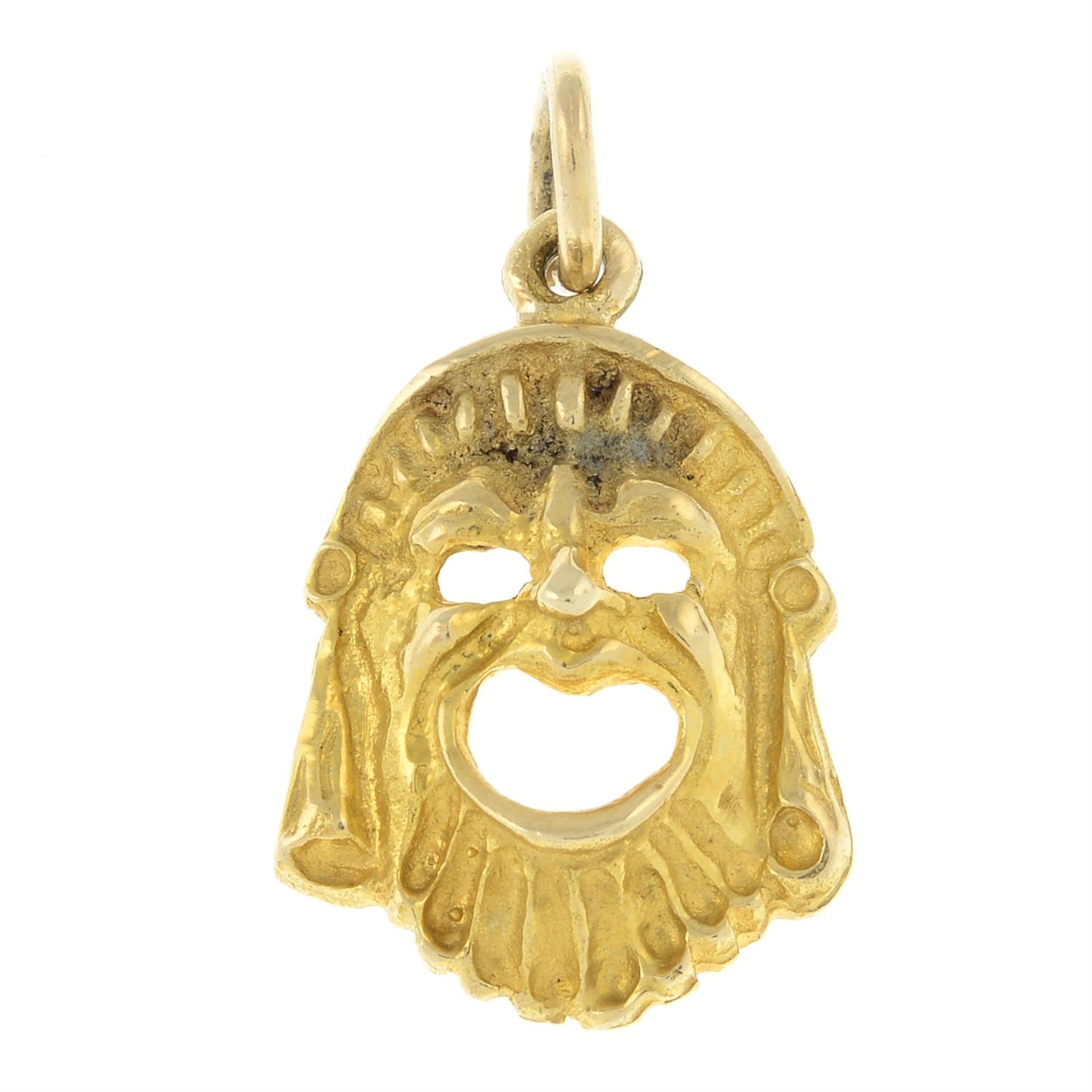 A Greek tragedy 'Melpomene' mask pendant.