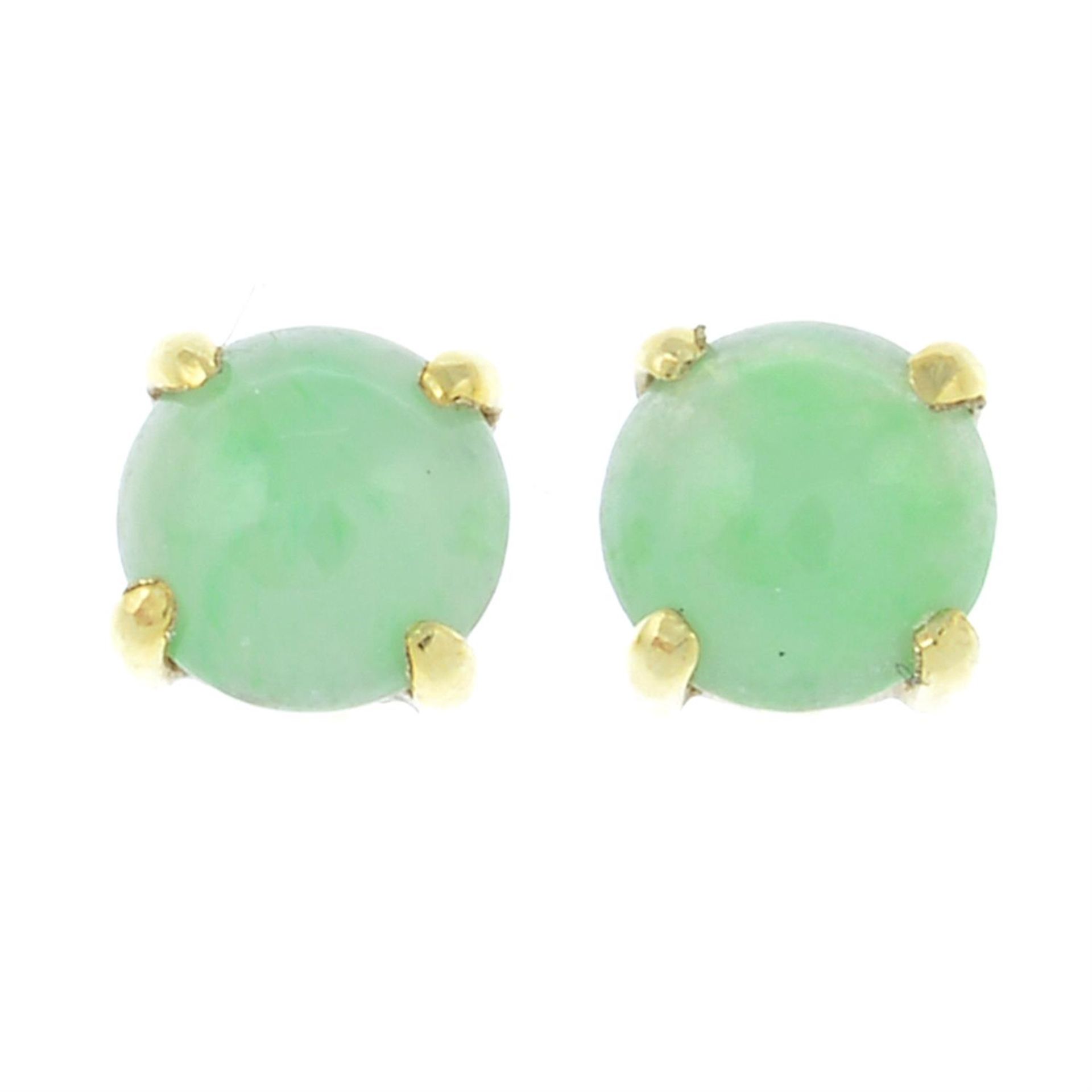 A pair of jade stud earrings.