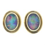 A pair of early 20th century gold opal triplet stud earrings.