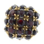 A garnet cluster dress ring.