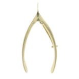 A wishbone brooch.