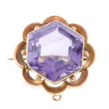 An early 20th century gold hexagonal-shape amethyst brooch.