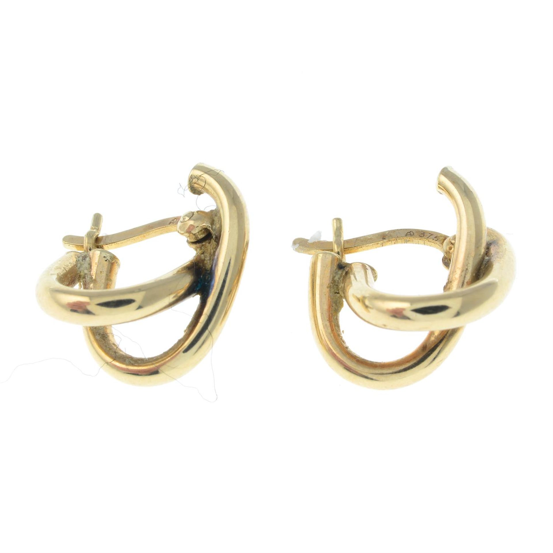 A pair of crossover hoop earrings. - Image 2 of 2