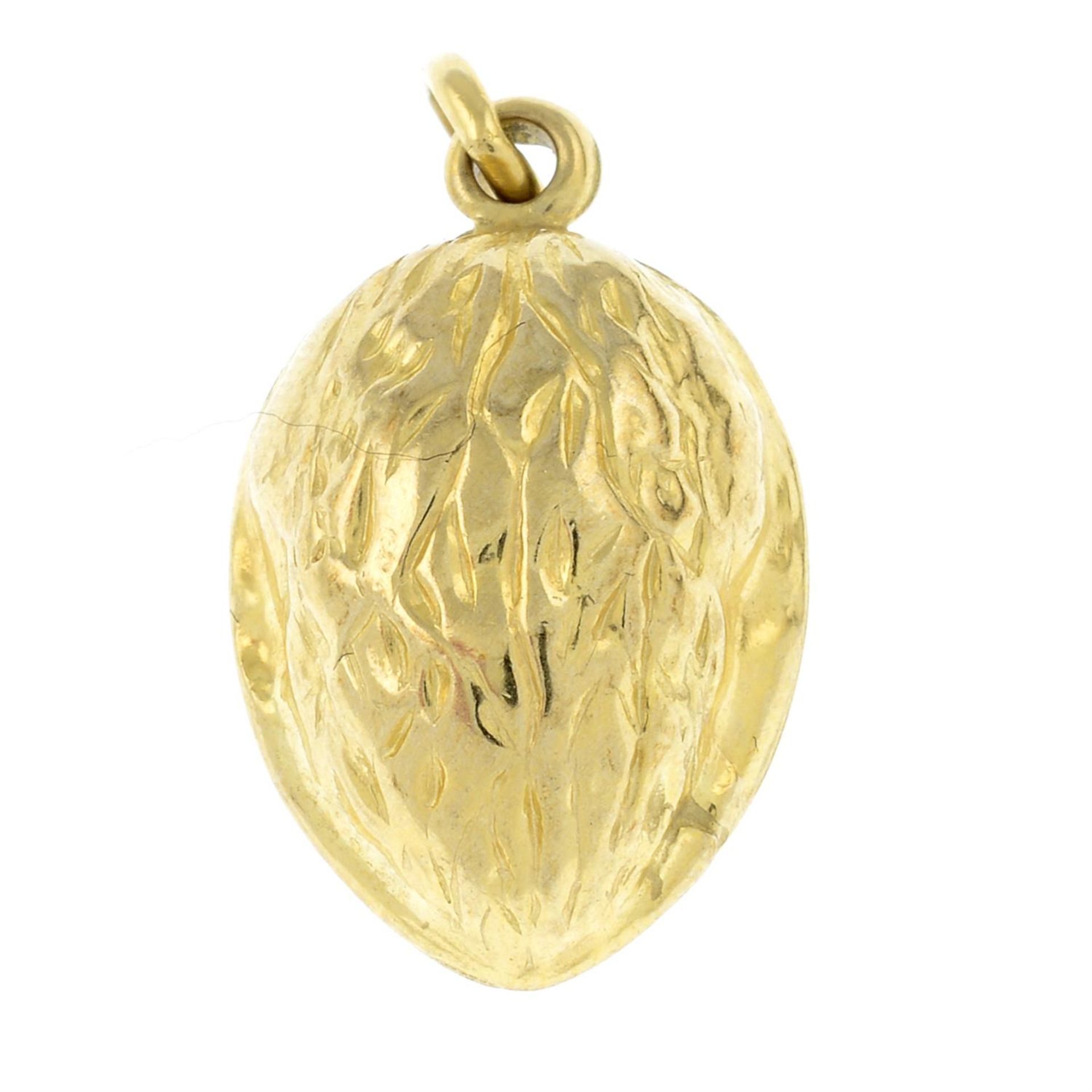 A 9ct gold walnut pendant.