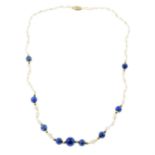 A graduated lapis lazuli and a blister pearl single-strand necklace.