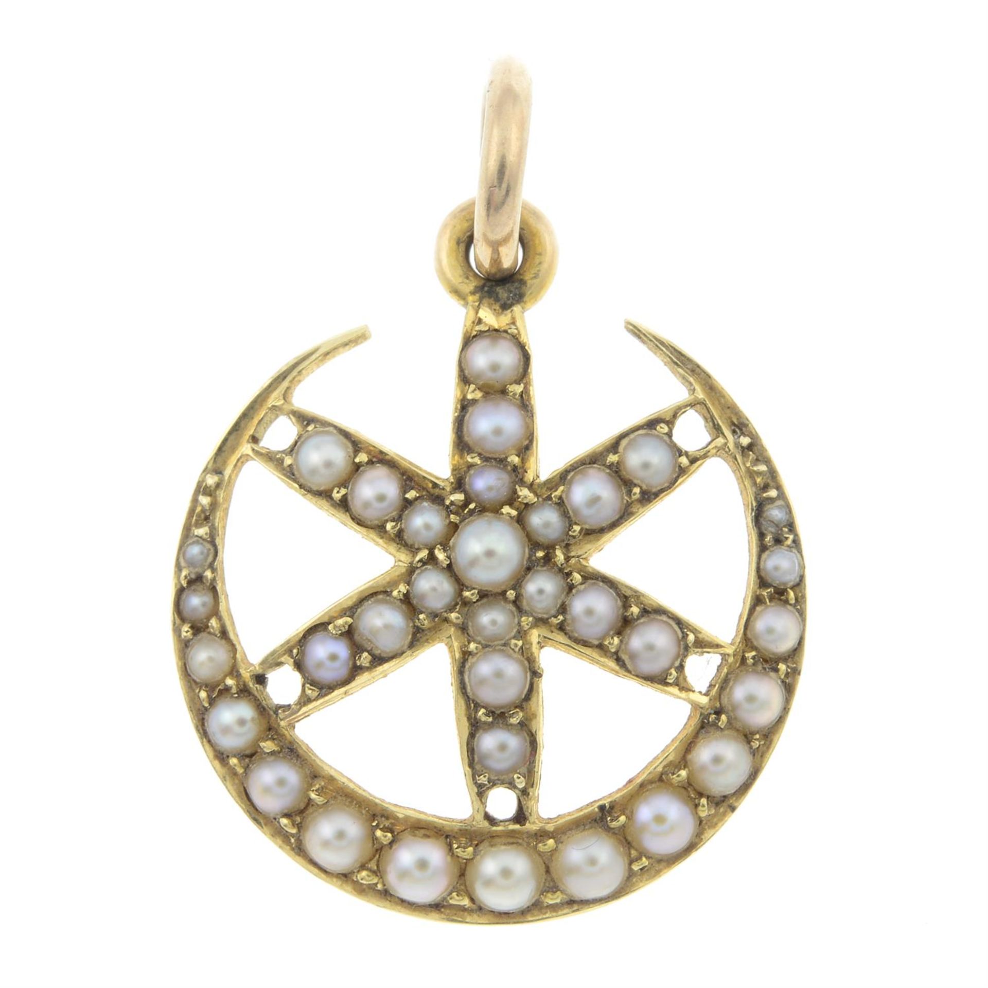 An early 20th century gold split pearl crescent moon and star pendant.