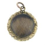 A late Victorian mourning locket, with plaited hair insert.